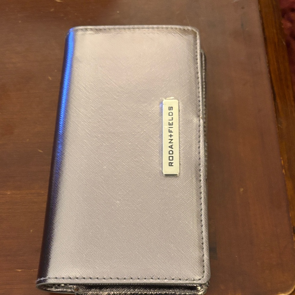 Rodan + Fields Metallic Silver Wallet